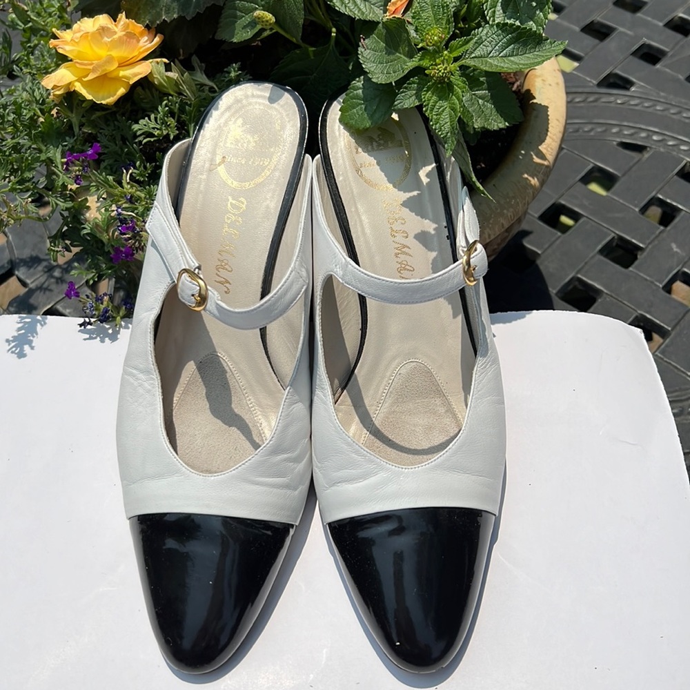 Classic Delman white and black mules, with buckle and patent toe/heel